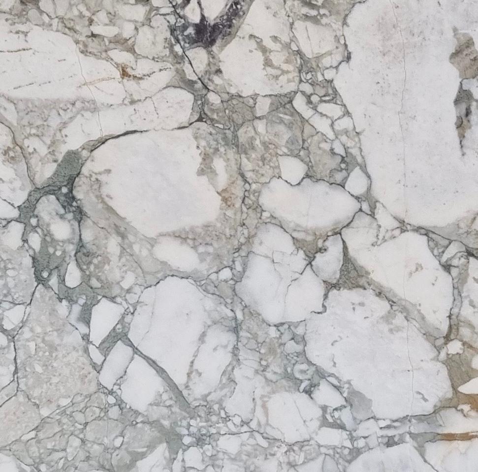 Calacatta Green marble sample with natural veining – ideal for custom table designs or interior accents from MERAKI MARBLE