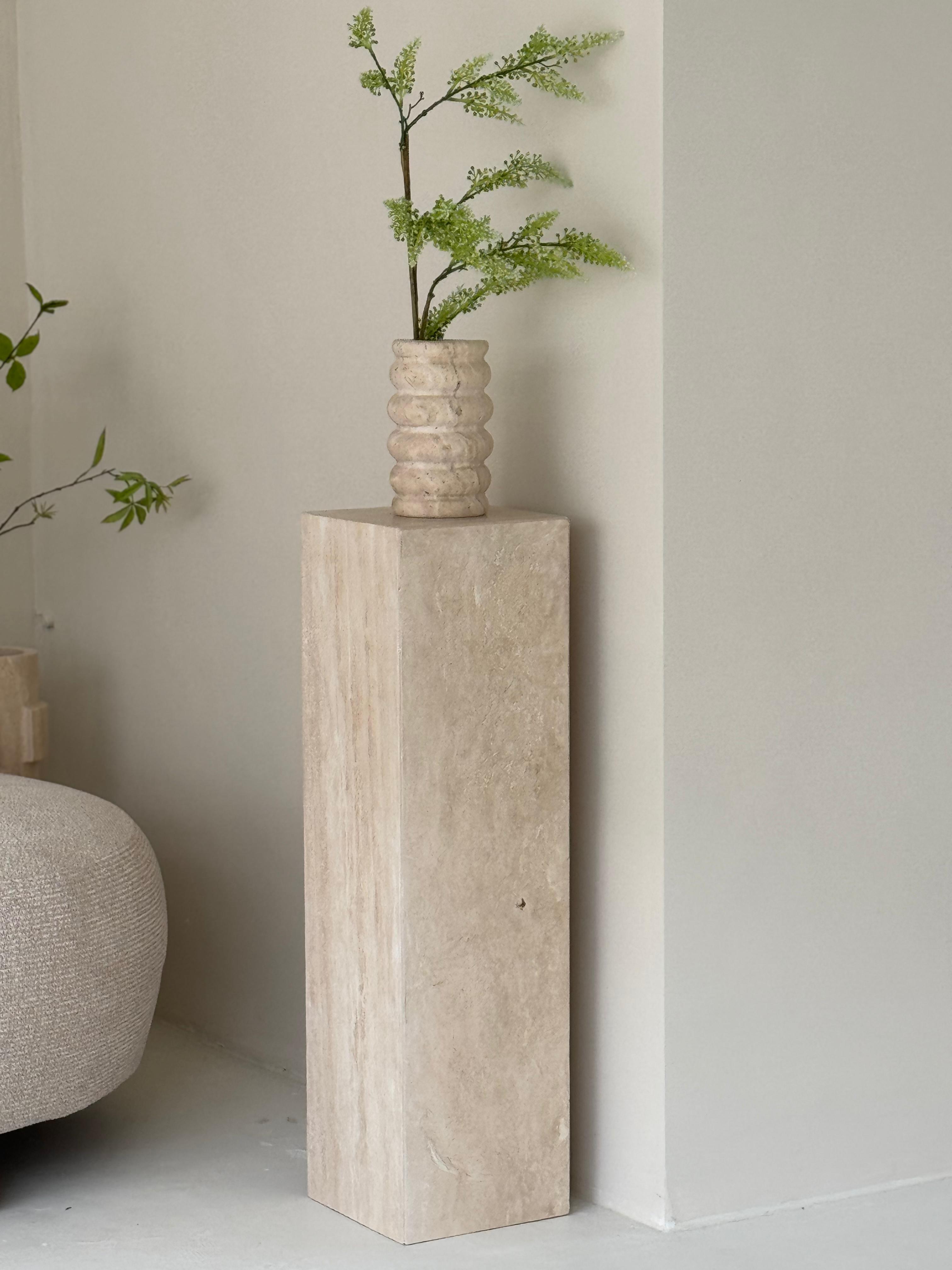 Lucy Travertine Pillar styled with vase in modern interior