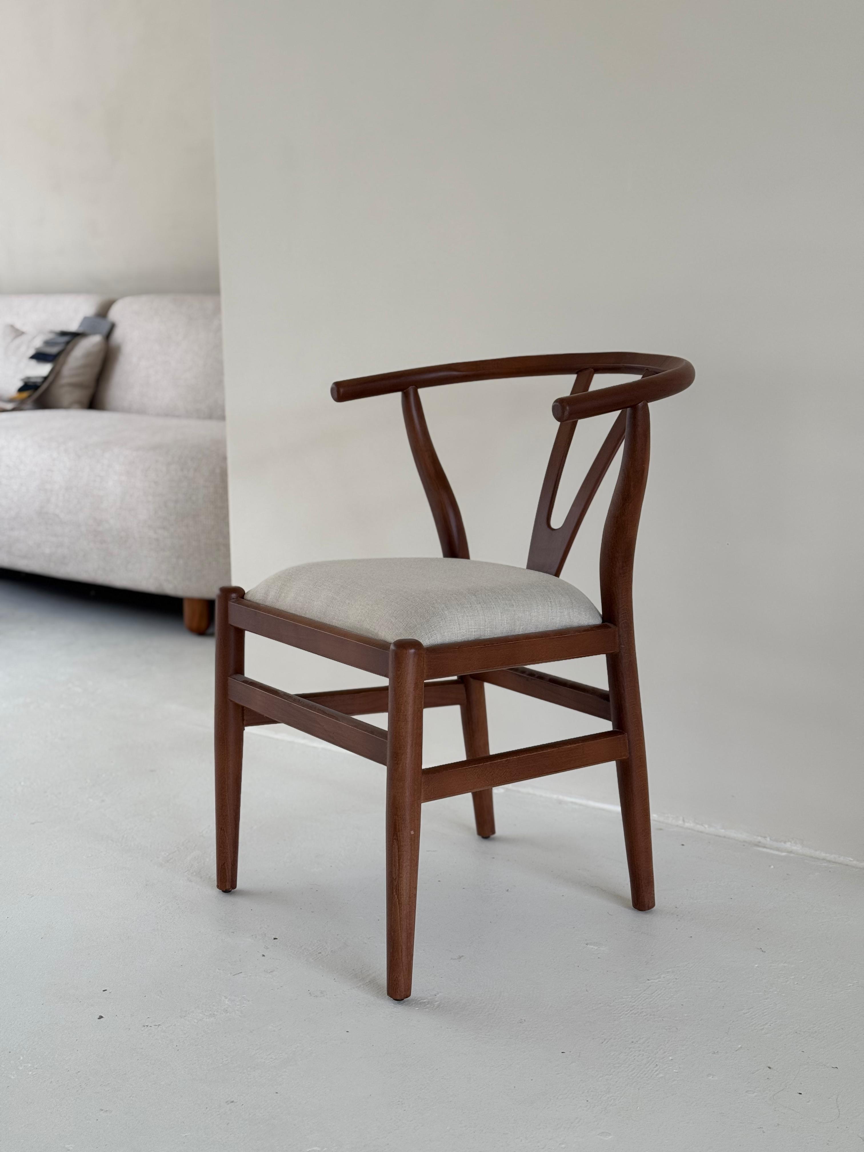 Side view of Nyx Dining Chair showcasing elegant form and artisan craftsmanship