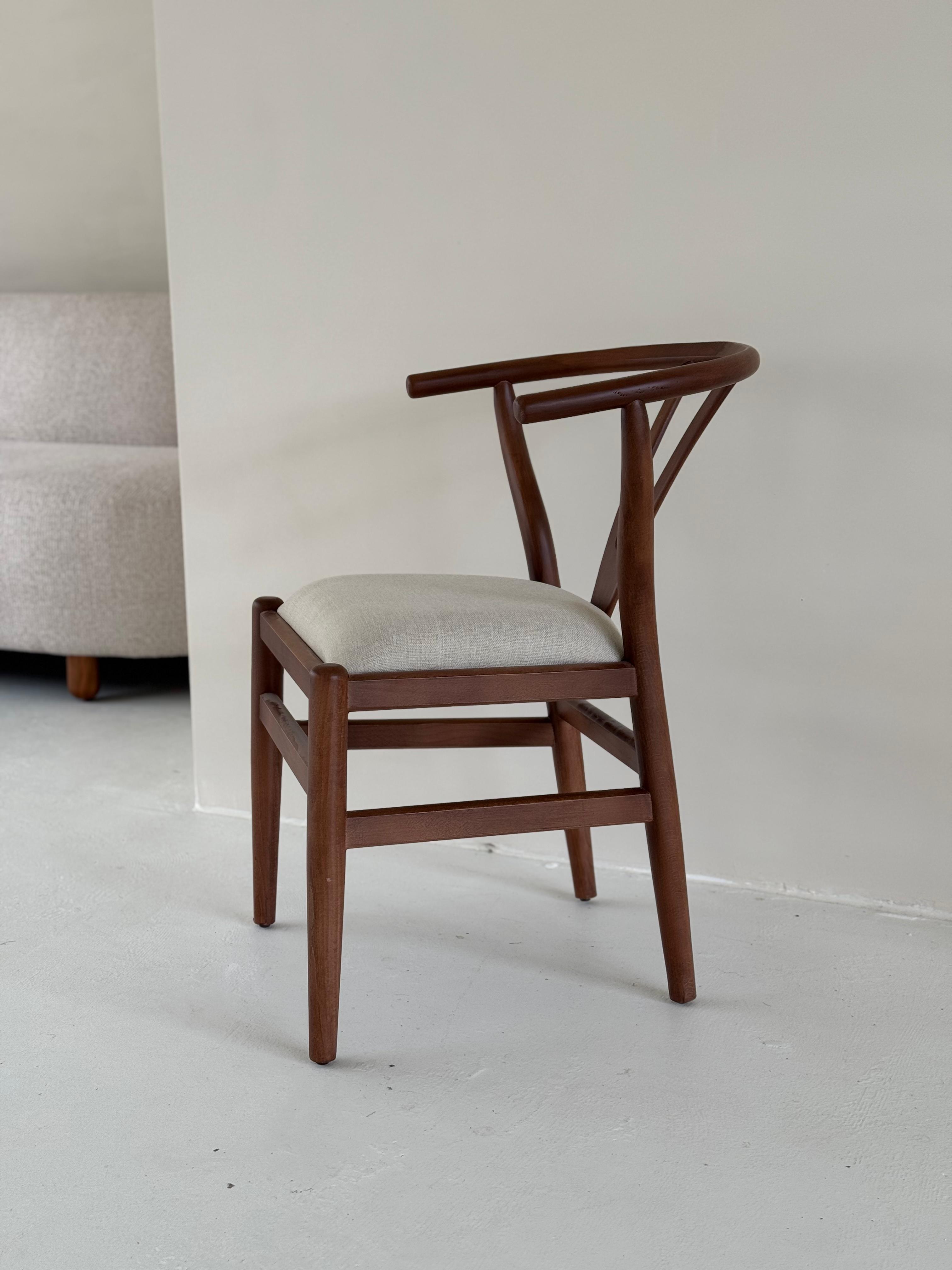 Side view of Nyx Dining Chair showcasing elegant form and artisan craftsmanship