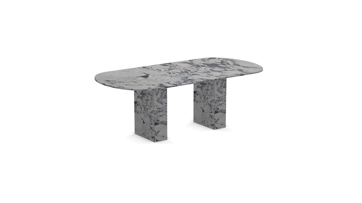 Detailed shot of the purple and burgundy veining on the oval Calacatta Viola marble top supported by two block legs.