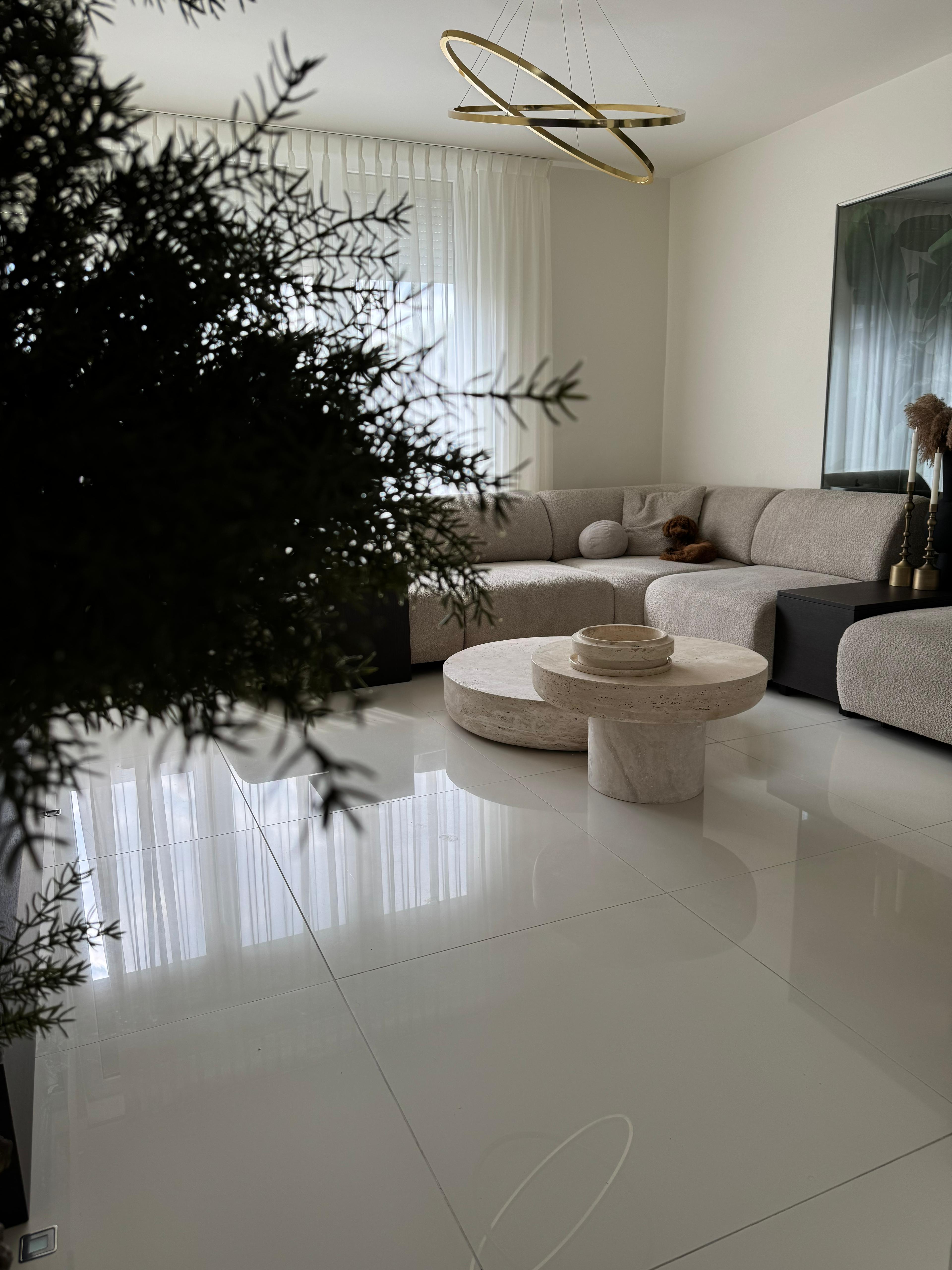 Side view showing fluted travertine table base design