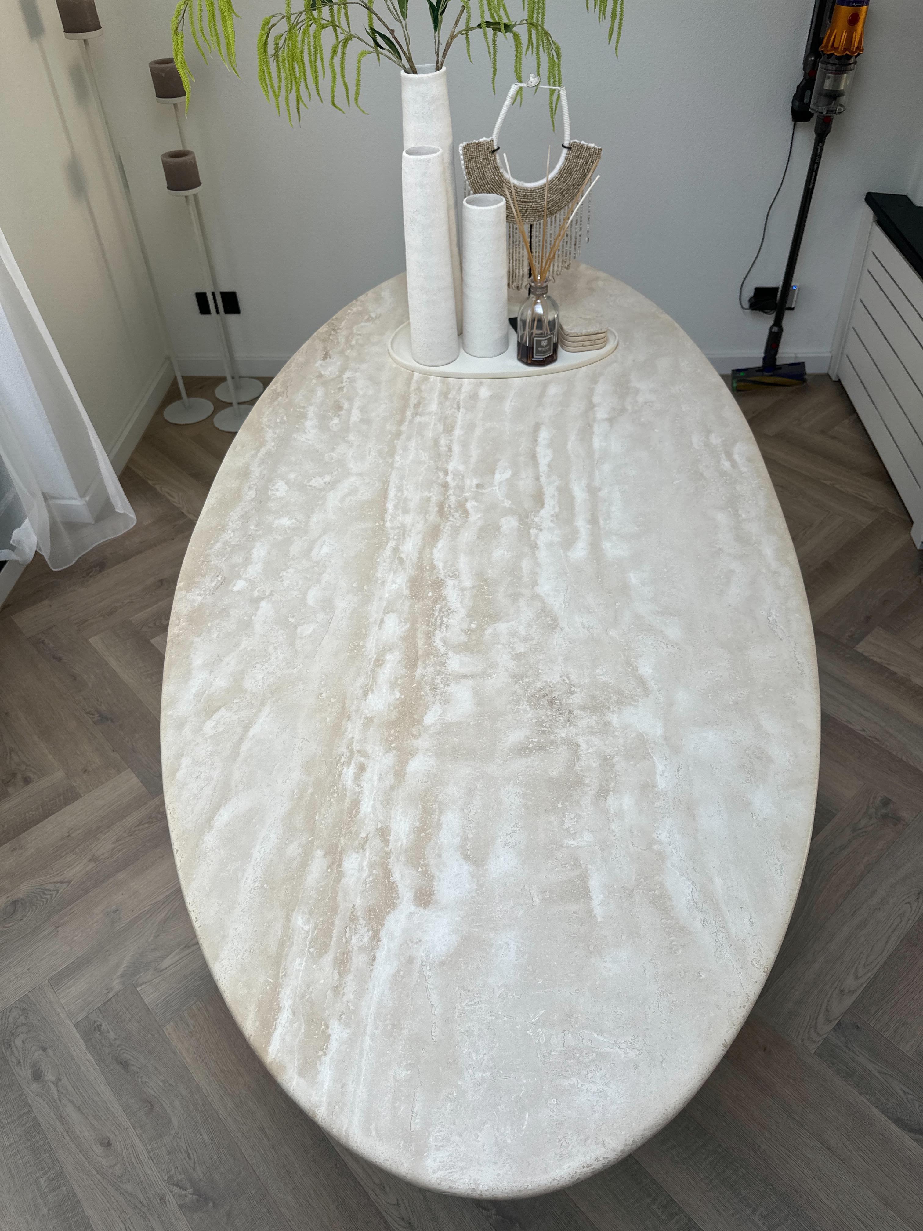 Minimalist interior with Travertine Oval Dining Table | Cone Leg as centerpiece