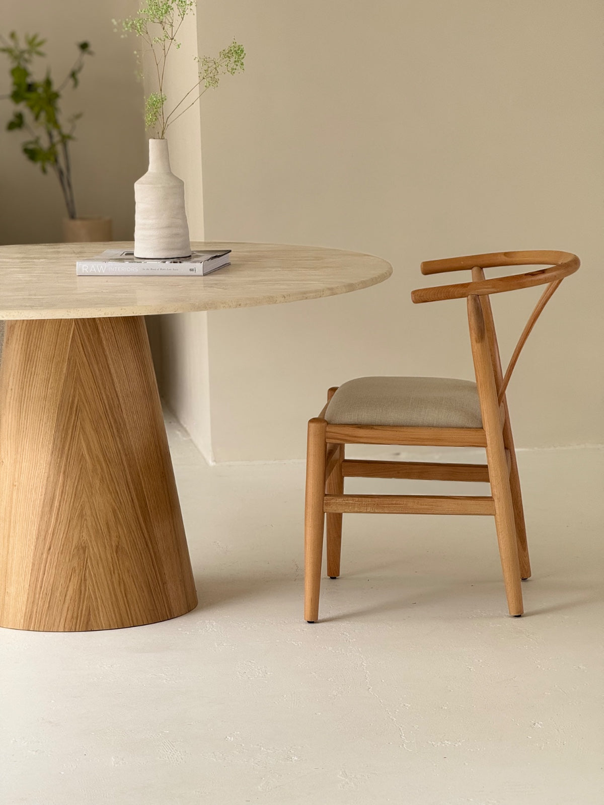 Side view of Nyx Dining Chair showcasing elegant form and artisan craftsmanship