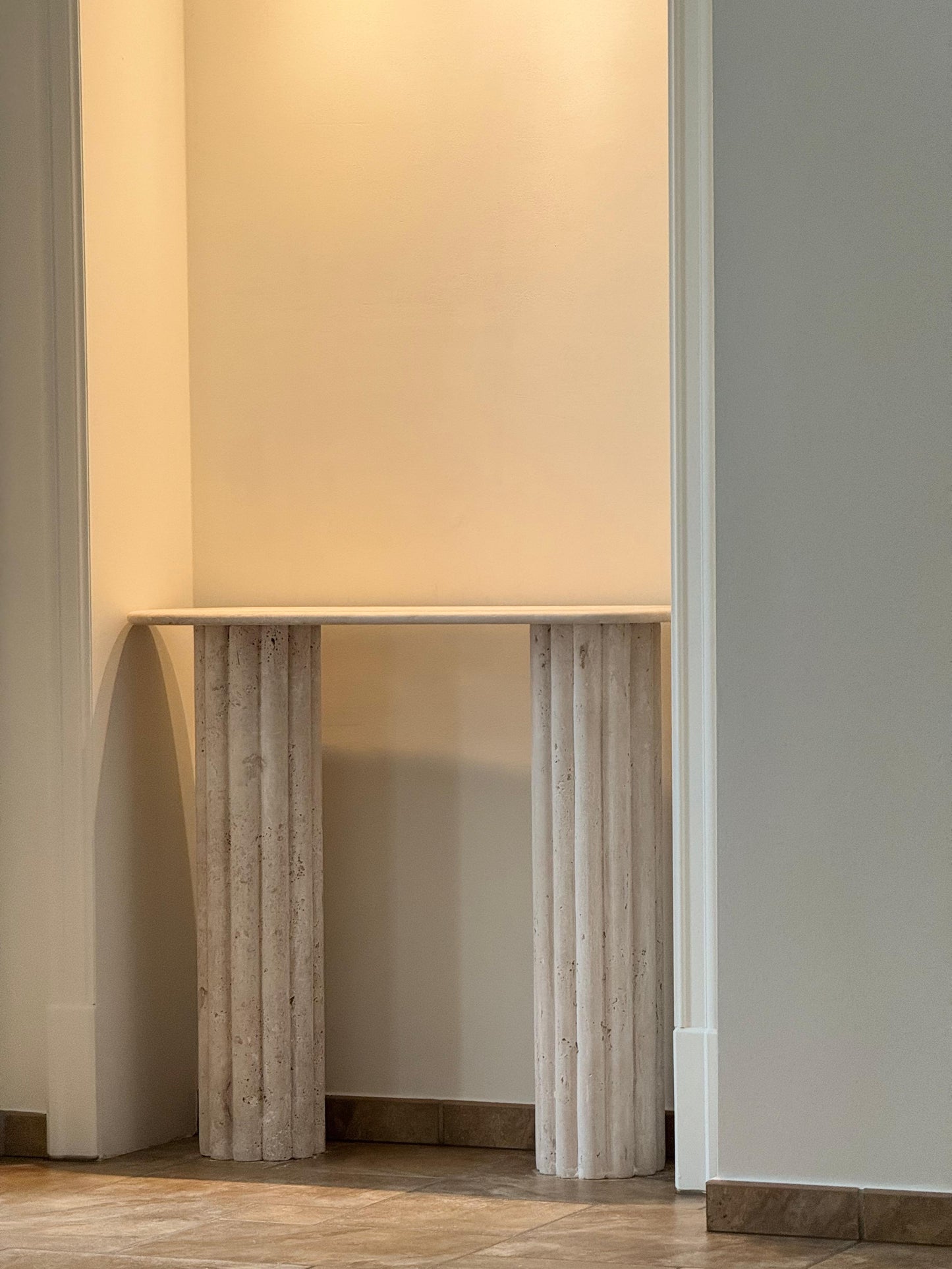 Colosseum travertine console table with fluted cylindrical bases