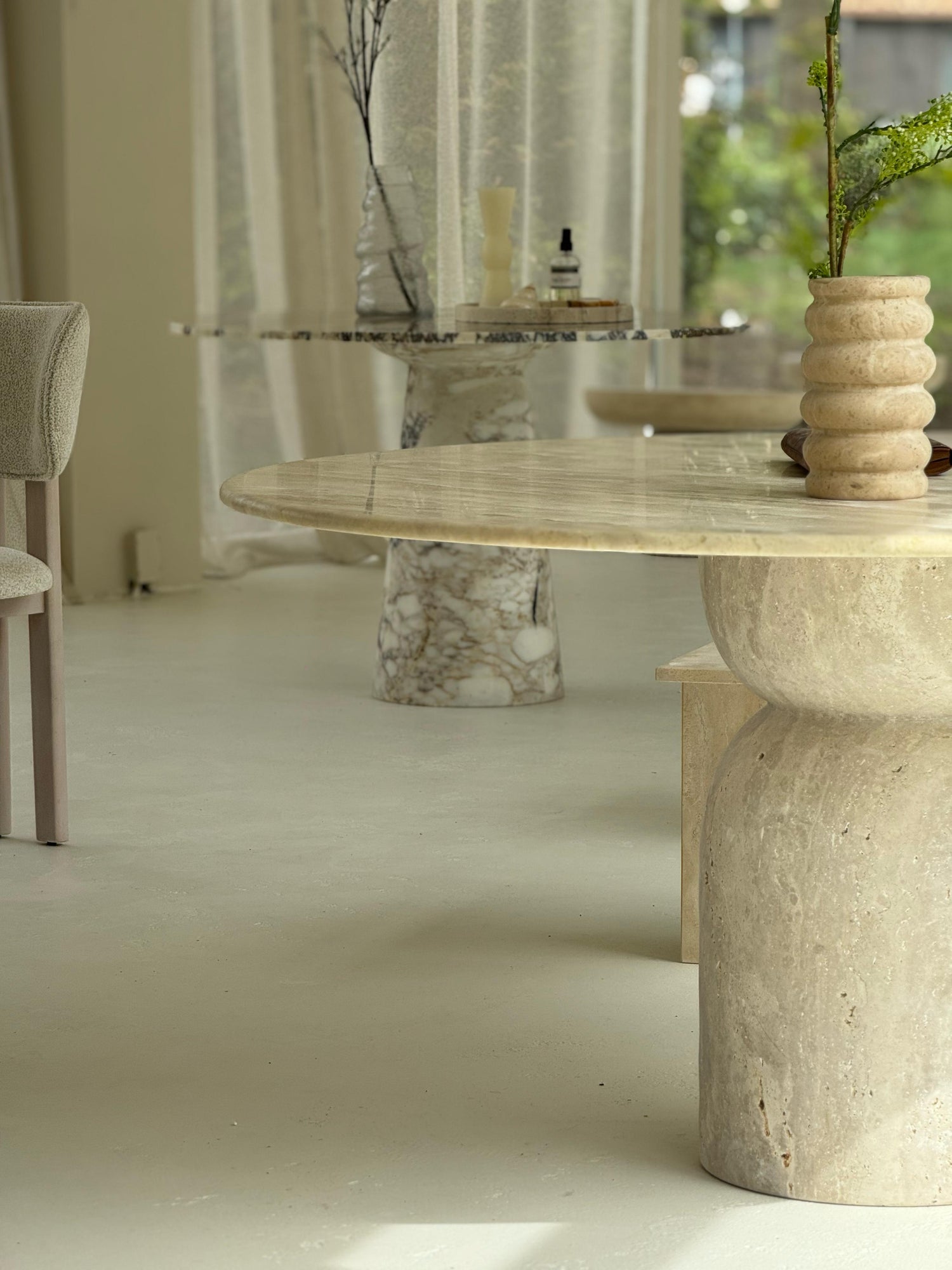 Handmade travertine dining table in natural stone by MERAKI MARBLE