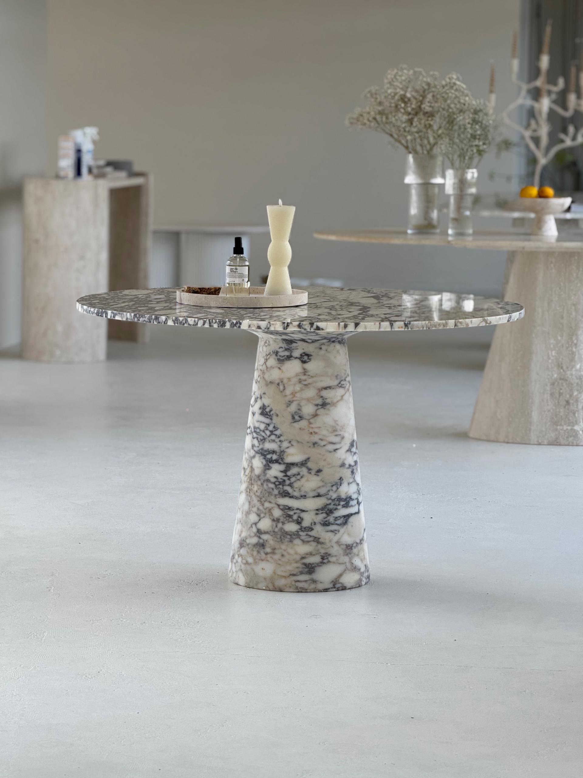 The Conical Violet | Marble Round Dining Table displayed in a minimalist interior