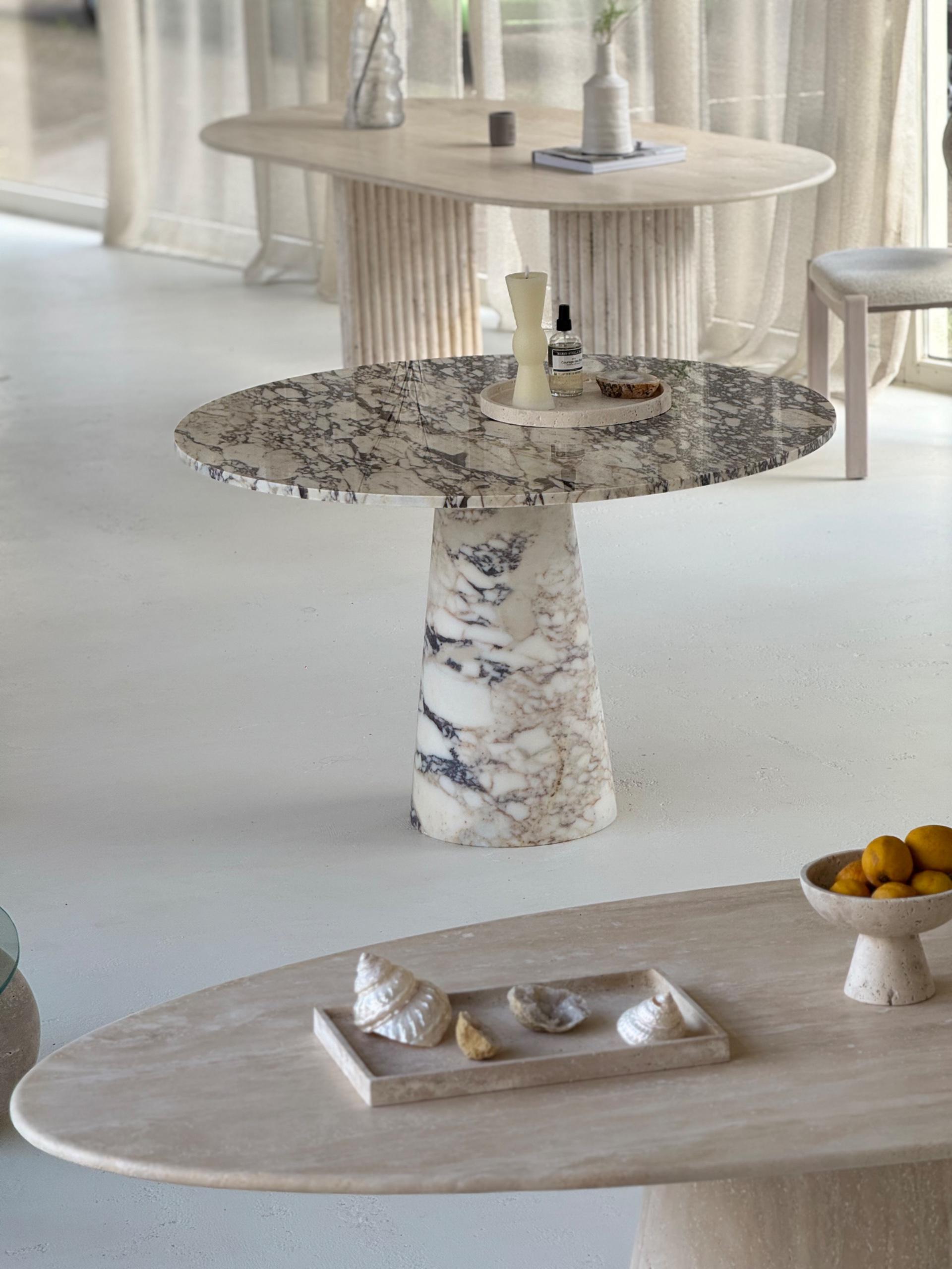 The Conical Violet | Marble Round Dining Table displayed in a minimalist interior