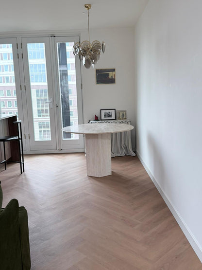 Round travertine veincut dining table | Hexa Beam Design