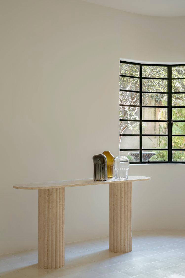 Colosseum travertine console table with fluted cylindrical bases